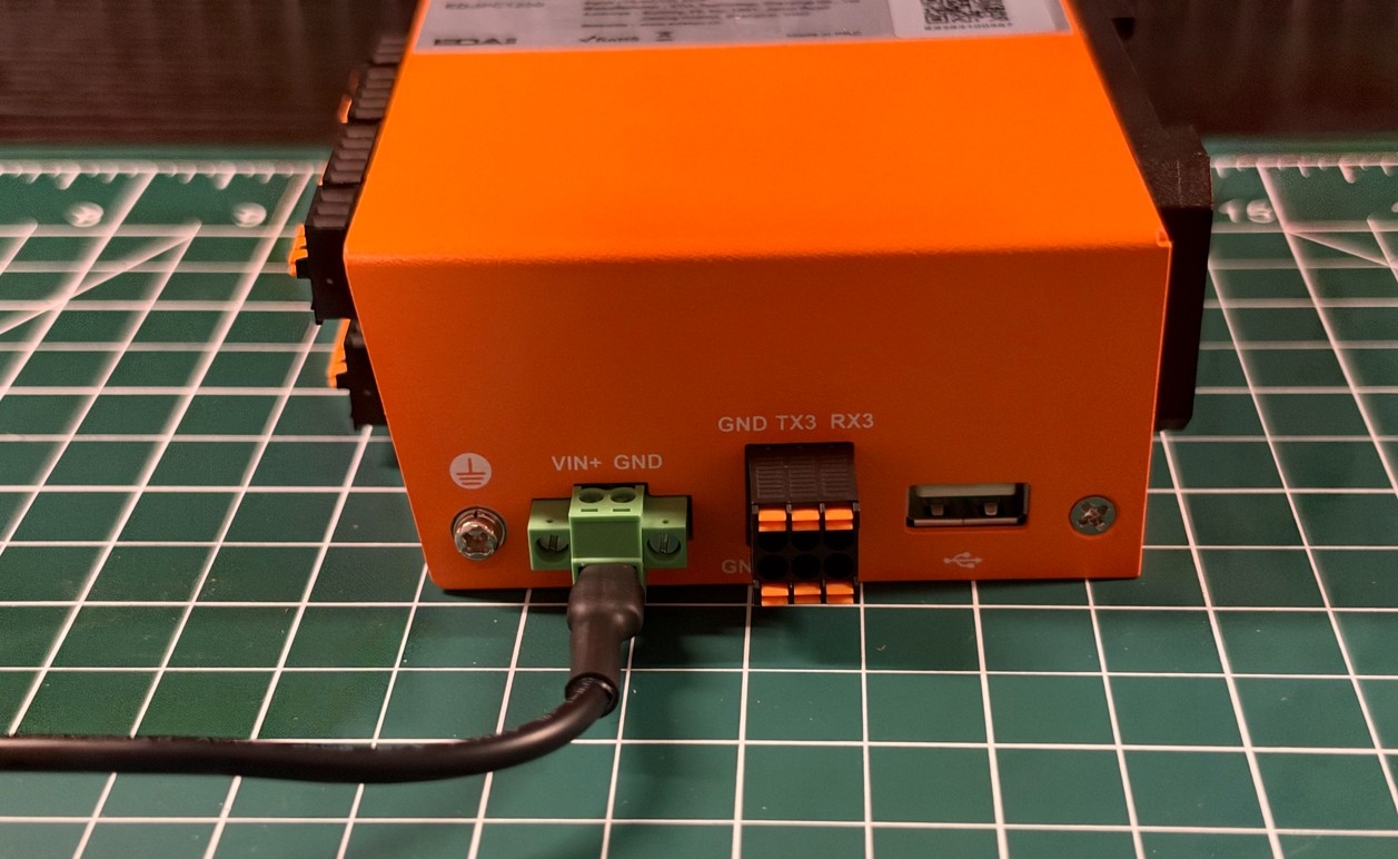 Close view of the ED-IPC1220 power input, ground point, GND TX3 RX3 terminal, and USB-A port